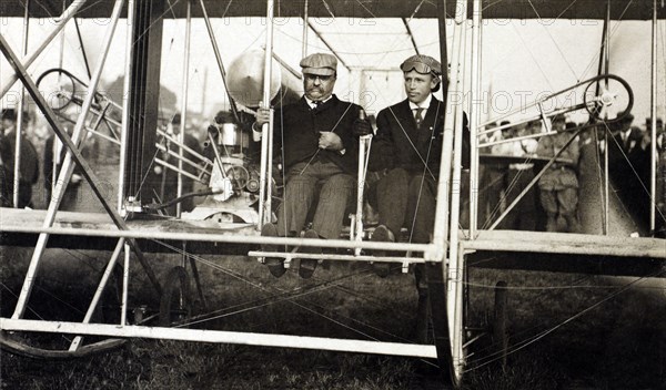Theodore Roosevelt and Archibald Hoxsey in Biplane Preparing for Flight, Kinloch Field, St. Louis, Missouri, USA, Photograph by Cole & Co., October 11, 1910