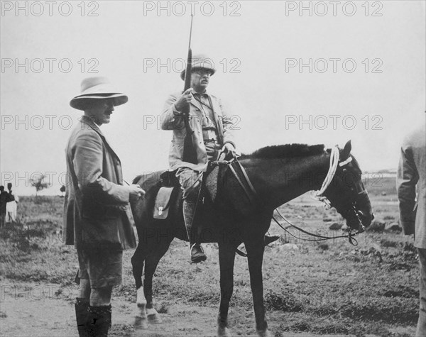 Former U.S. President Theodore Roosevelt on Horseback, Holding Rifle, during Safari, Africa, Smithsonian-Roosevelt African Expedition, Photograph by Warrington Dawson, March 1910