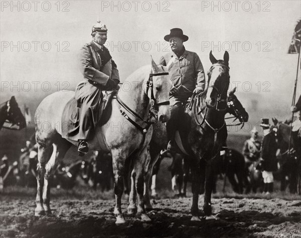 Former U.S. President Theodore Roosevelt and Kaiser Wilhelm II Riding on Horseback Attending Military Field Maneuvers with German Troops in Background, Doberitz, Germany, Photograph by Underwood & Underwood, 1910