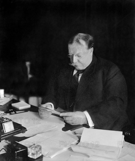 U.S. President William Howard Taft Reading at his Desk, White House, Washington, D.C., USA, Photograph by Barnett McFee Clinedinst, 1909