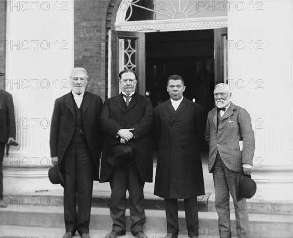 (Left to right) Robert C. Ogden, U.S. Secretary of War William Howard Taft, Booker T. Washington and Andrew Carnegie, Standing on steps of building at Tuskegee Institute during its 25th Anniversary Celebration, Tuskegee, Alabama, USA, Photograph by Francis Benjamin Johnston, July 1906