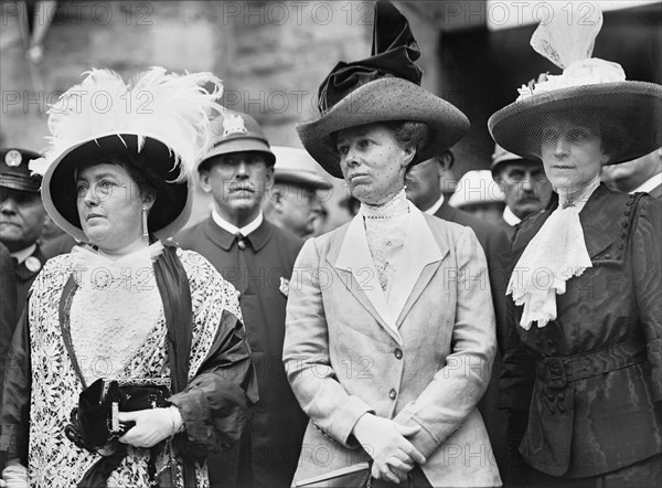 L-R: Mrs. Norman E. Mack, First Lady Helen Herron Taft, Mrs. Hugh Wallace, Half-Length Portrait while in attendance at the Democratic National Convention, Fifth Regiment Armory, Baltimore, Maryland, USA, Photograph by Harris & Ewing, July 1912