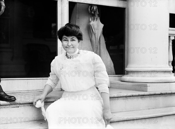 Ellen Axson Wilson (1860-1914), First Wife of U.S. President Woodrow Wilson, who died in the second year of Wilson's Presidency, Half-length Portrait Standing on Porch Steps of Summer Residence, Sea Girt, New Jersey, USA, Bain News Service, July 1912