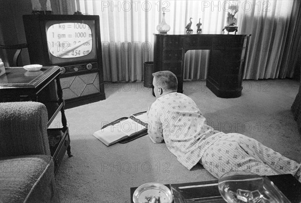 Pajama-clad Boy being Educated via Television during period that Schools were Closed to Avoid Integration, Little Rock, Arkansas, USA, photograph by Thomas J. O'Halloran, September 1958