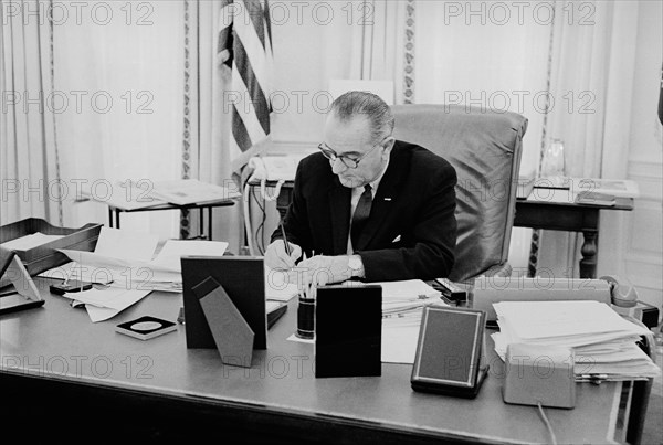 U.S. President Lyndon Johnson working at Desk in Oval Office in White House, Washington, D.C., USA, photograph by Thomas J. O'Halloran, February 1964