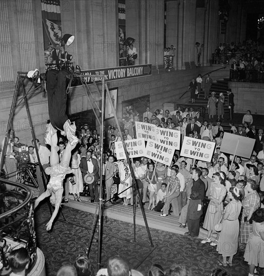 Crowd Watching Acrobat Act while Holding "Swing for Ewing Signs" for Candidate Oscar R. Ewing, Democratic National Convention, International Amphitheatre, Chicago, Illinois, USA, photograph by Thomas J. O'Halloran, July 1952