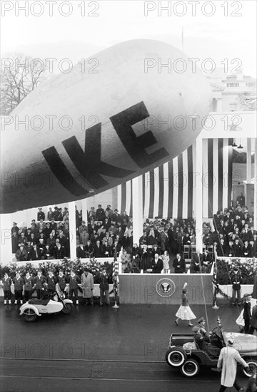 U.S. President Dwight Eisenhower and U.S. Vice President Richard Nixon Reviewing Inauguration Parade, First Lady Mamie Eisenhower and Second Lady Pat Nixon seated behind, Washington, D.C., USA, photographer Thomas J. O'Halloran, Warren K. Leffler, January 21, 1957
