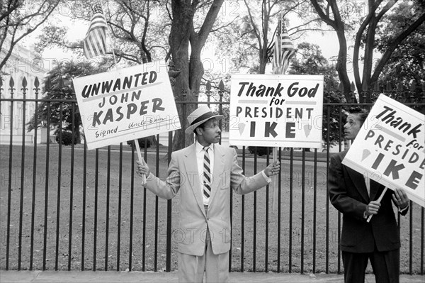 Two Men Protesting John Kasper, an American far-right activist and Ku Klux Klan member who took a militant stand against racial integration during the civil rights movement, Washington, D.C., USA, photograph by Thomas J. O'Halloran, October 1957