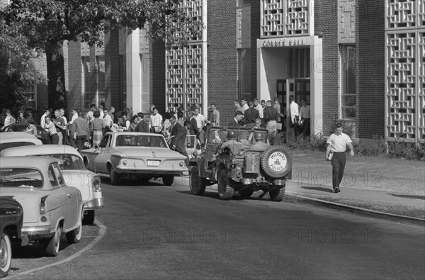 Students and Soldiers in Military Vehicle outside of buildings during Integration of University of Mississippi, Oxford, Mississippi, USA, photograph by Marion S. Trikosko, October 4, 1962