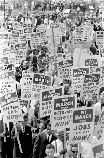 Demonstrators marching in Street holding Signs during March on Washington for Jobs and Freedom, Washington, D.C., USA, photograph by Marion S. Trikosko, August 28, 1963