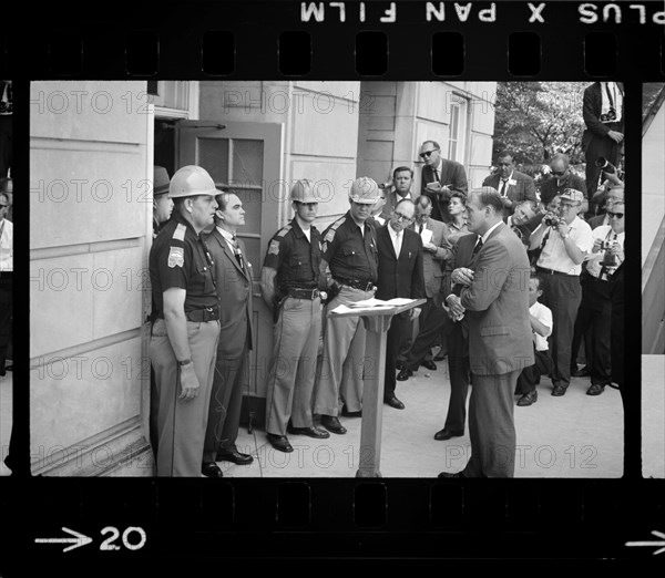 Governor George Wallace attempting to block Integration by standing defiantly at Door while being confronted by Deputy U.S. Attorney General Nicholas Katzenbach, University of Alabama, Tuscaloosa, Alabama, USA, photograph by Warren K. Leffler, June 11, 1963