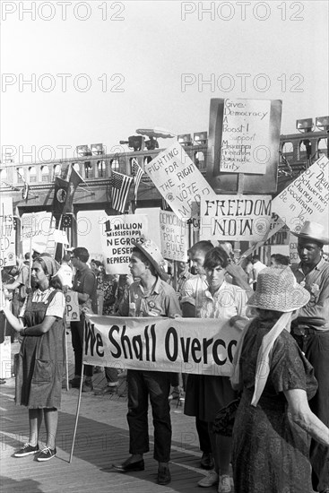 African American and white supporters of the Mississippi Freedom Democratic Party holding signs in front of the convention hall at the 1964 Democratic National Convention, Atlantic City, New Jersey, USA, photograph by Warren K. Leffler, August 25, 1964