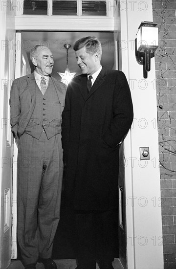 U.S. President-Elect John F. Kennedy and former U. S. Secretary of State Dean Acheson, standing in the doorway of Acheson's home at 2805 P Street, N.W., Washington, D.C., photograph by Marion S. Trikosko, November 26, 1960