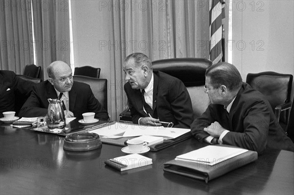 U.S. Secretary of Defense Robert McNamara (right), U.S. President Lyndon Johnson and U.S. Secretary of State Dean Rusk, seated at a table after McNamara's return from South Vietnam, Washington, D.C., USA, photograph by Warren K. Leffler, July 21, 1965
