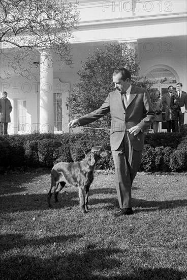 U.S. President Richard Nixon with his Pet, King Timahoe, an Irish Setter, on White House Lawn, Washington, D.C., USA, photograph by Warren K. Leffler, January 28, 1969