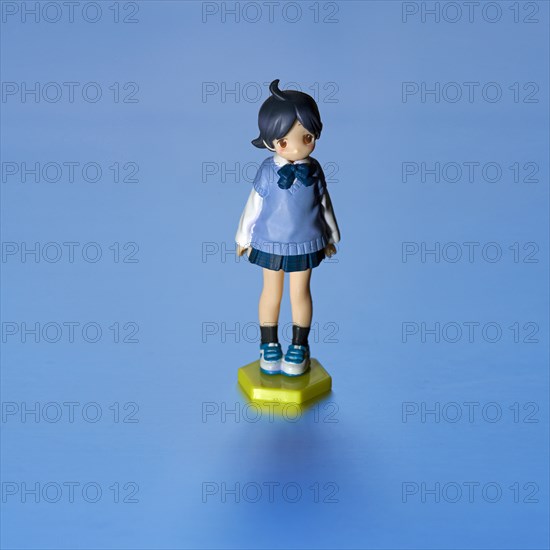 Young Girl Figurine, Blue against Blue Background