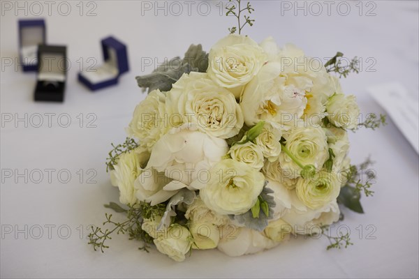 Bouquet of Flowers and Set of Wedding Rings, Selective Focus