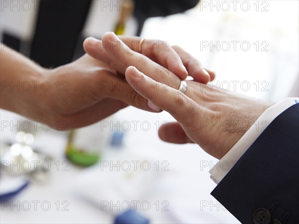 Bride and Groom Exchanging Rings at Wedding Ceremony