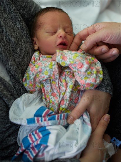 Newborn Baby Girl with Mother and Father in Hospital