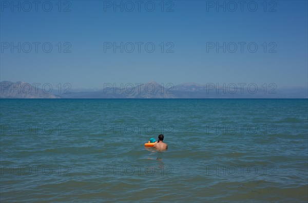 Man and Young Child Swimming, Patras, Greece