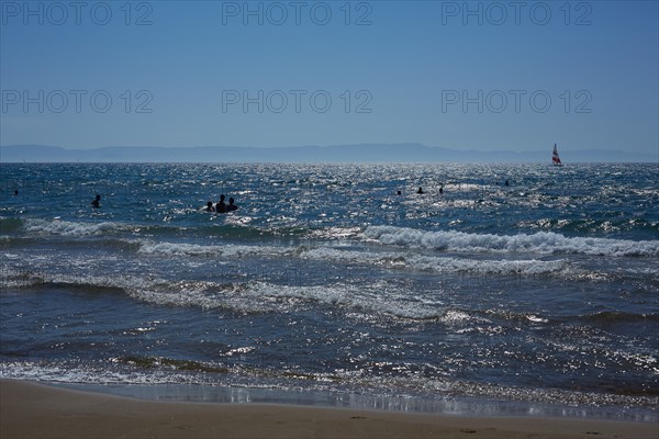 Silhouette of People Swimming in Sea, Patras, Greece