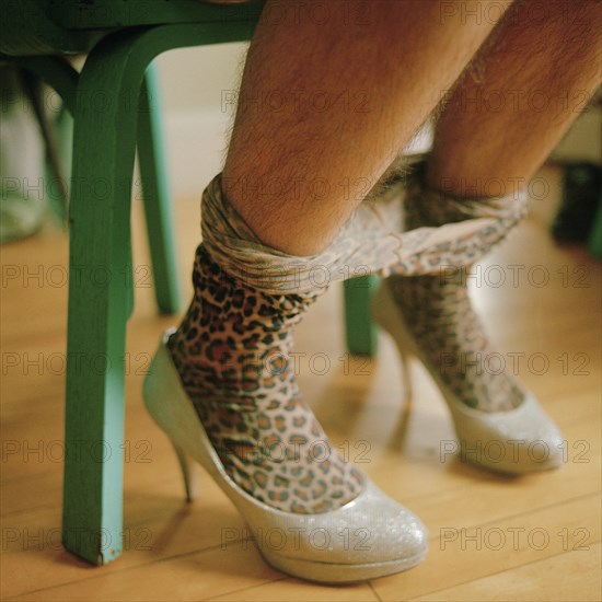 Man's Legs with Leopard Tights Pulled down to his High Heel Shoes