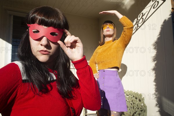 Portrait of Two Women Wearing Mask and Sunglasses