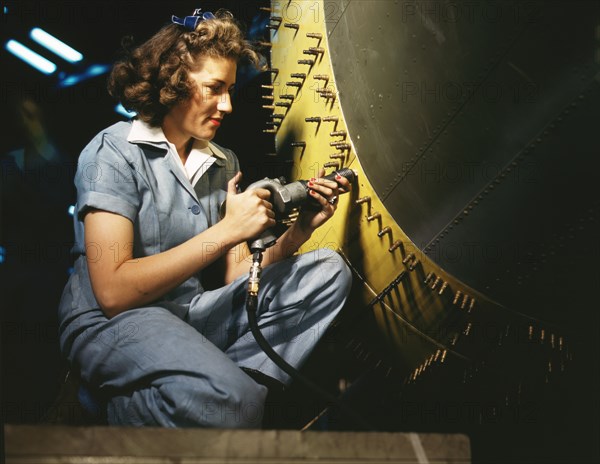 Riveter at Work on Consolidated Bomber