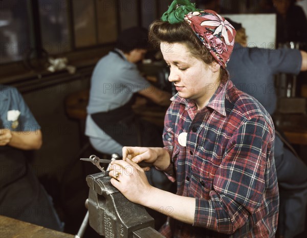 War Production Worker filing Small Gun Parts