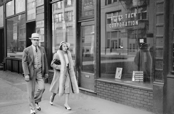 Couple Walking on Sidewalk