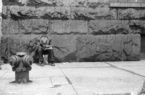 Man seated on Corner of Jefferson Street and Vernon Park Place