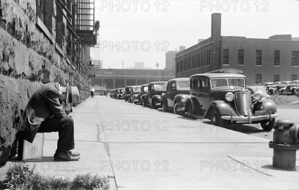 Man seated on Corner of Jefferson Street and Vernon Park Place