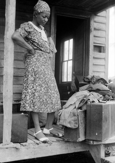 Georgia Migratory Agricultural Worker waiting for Truck that will take her to another job at Onley