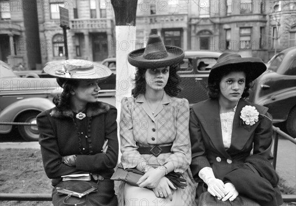 Three Young Adult Women waiting for Episcopal Church to end so they can see the Processional