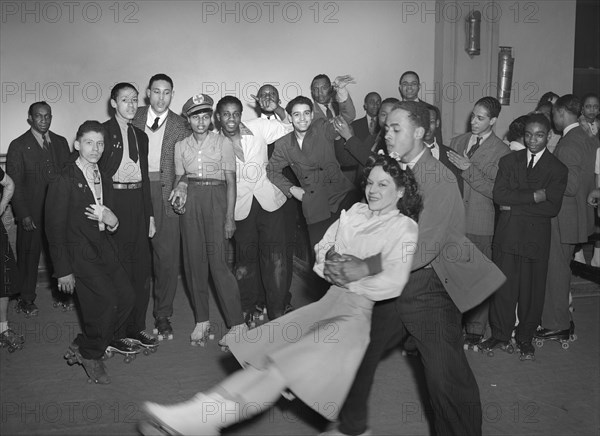 Man Swinging Girl on Roller Skates