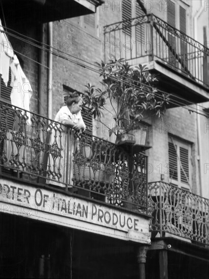 Woman leaning on Balcony