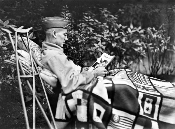 American Lieutenant with Leg Amputation reading American Red Cross Magazine in American Red Cross Military Hospital