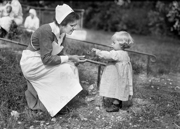 Young French Girl giving Flower to Nurse at American Red Cross Nursing ...