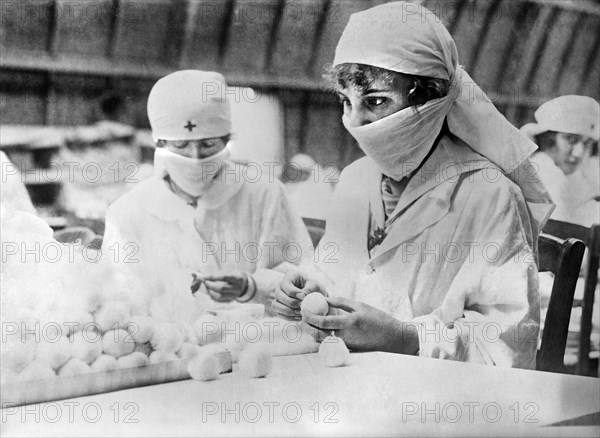 Two French Women making Cotton Balls for the Front Parcel at the American Red Cross Workrooms for Surgical Dressings