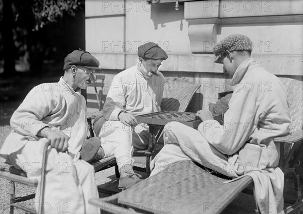 Patients enjoying Sun Bath and Game of Checkers in Garden of General Malterre's Hospital for mutilated Soldiers