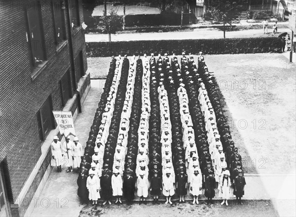 Junior Red Cross Auxiliary forming American Flag