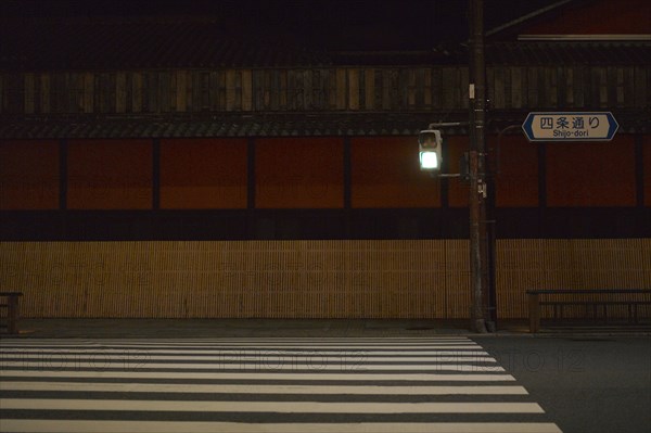 Green Traffic Light and Crosswalk at Night