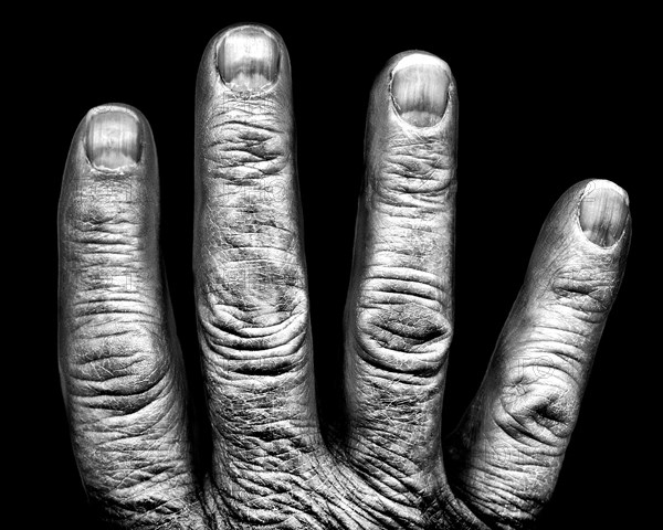 Four Fingers against Black Background