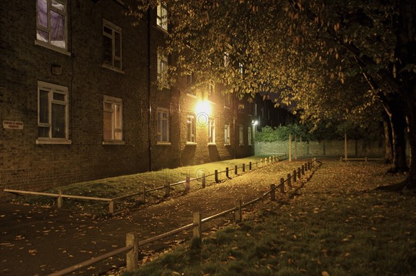 Illuminated Path by Apartment Building