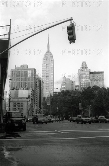 Street View of Empire State Building framed by Traffic Light