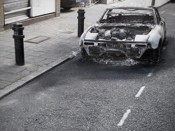 Burnt out Car on Road