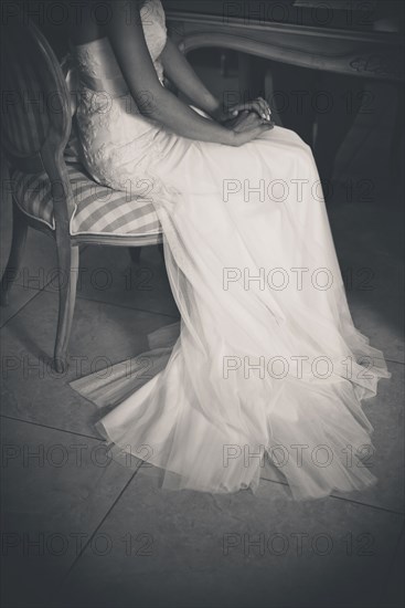 Bride sitting in Chair