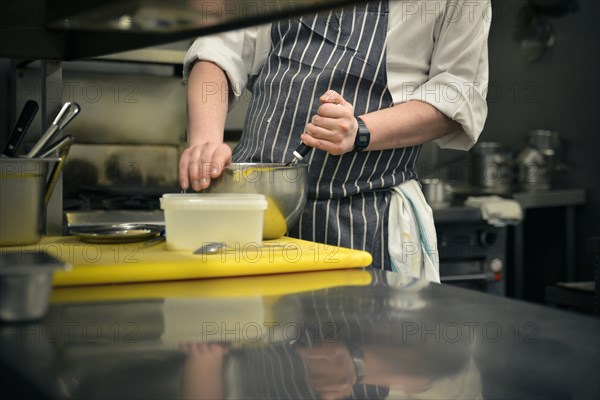 Professional Chef mixing in Bowl