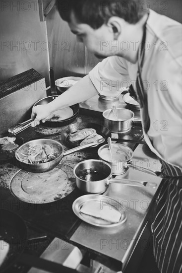 Chef Cooking on Restaurant Stove