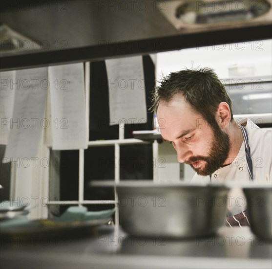 Head and Shoulders view of Chef in Restaurant Kitchen